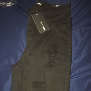 Size 15/ Lightly ripped skinny jeans.